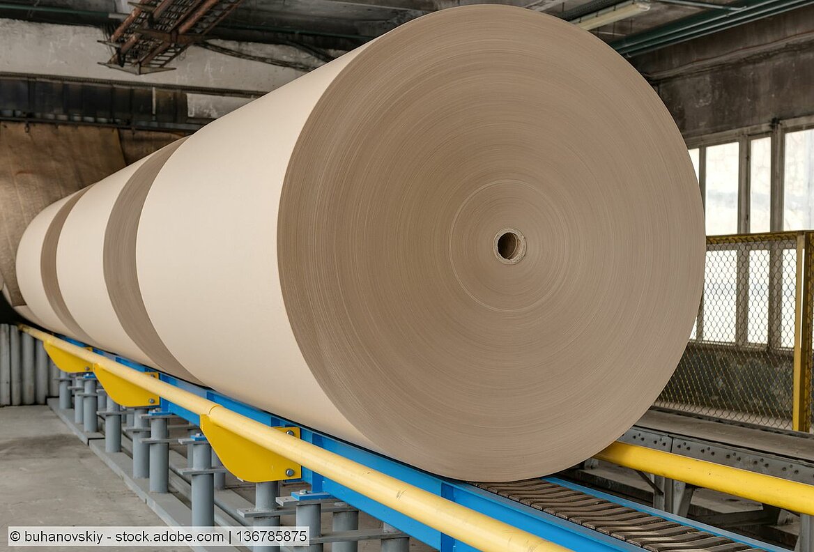 Symbolic image. Containerboard reels at paper mill.